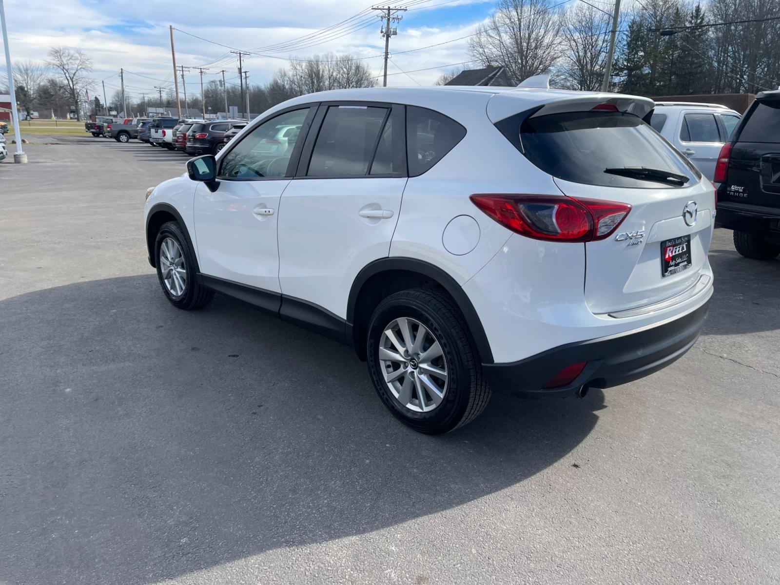 2015 White /Black Mazda CX-5 Touring AWD (JM3KE4CYXF0) with an 2.5L I4 DOHC 16V engine, 6-Speed Automatic transmission, located at 547 E. Main St., Orwell, OH, 44076, (440) 437-5893, 41.535435, -80.847855 - This 2015 Mazda CX-5 Touring AWD is a well-equipped SUV that offers a blend of performance, safety, and convenience for its drivers. Being a one-owner vehicle as per its Carfax report signifies well-attended maintenance and care. It is loaded with advanced features such as Blind Spot Monitoring and - Photo #12